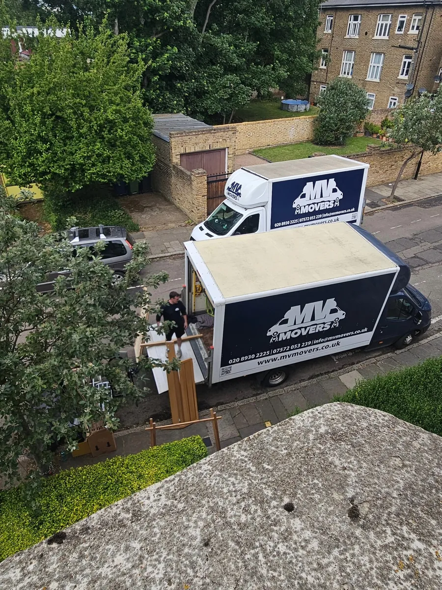 MV Movers van seen from above parked beside a garden and garage in West London